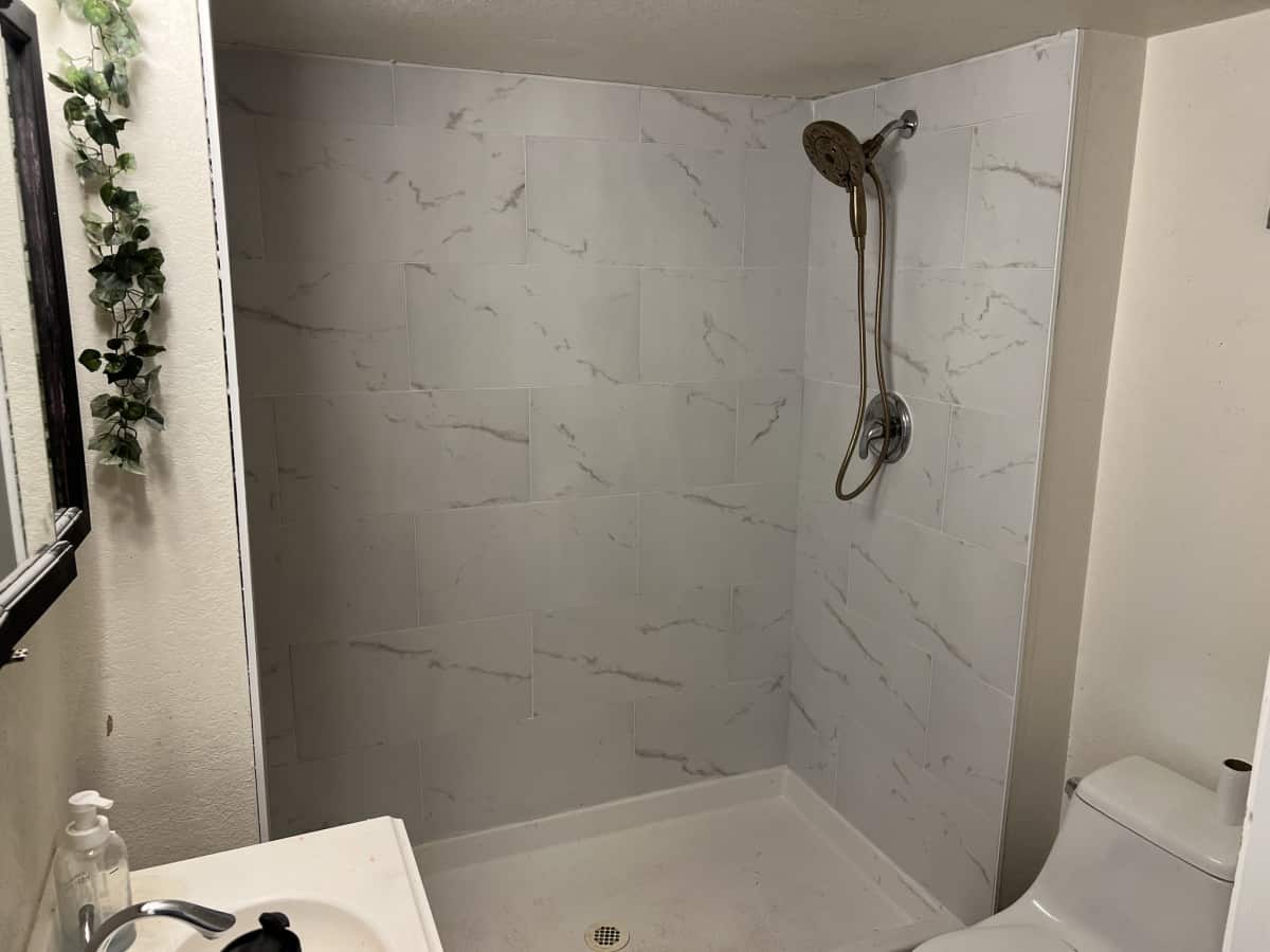 Remodeled Shower Remodeled shower with white marble wall in Denver, Co